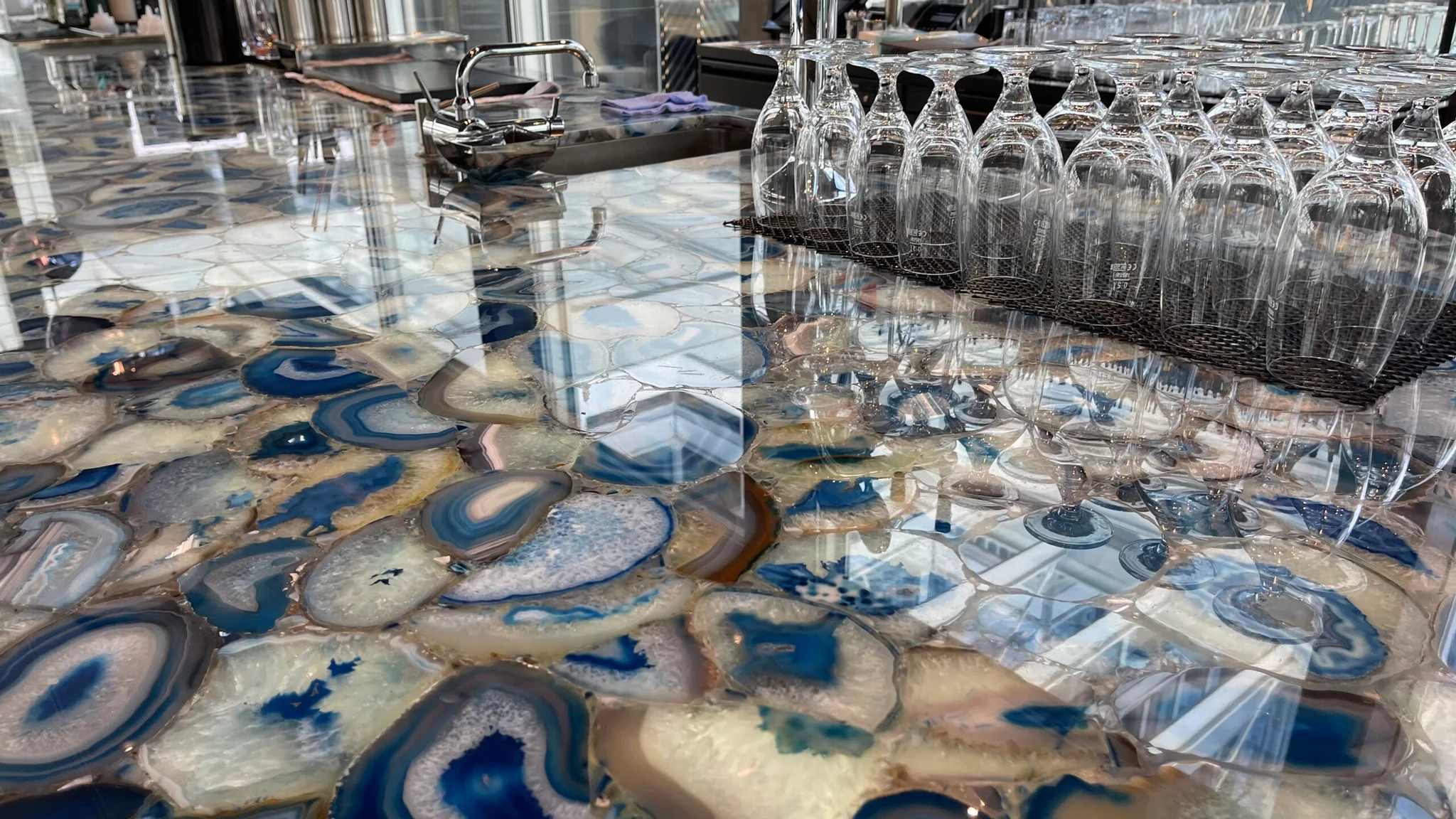 Glasses with blue and white marble designs on a table.